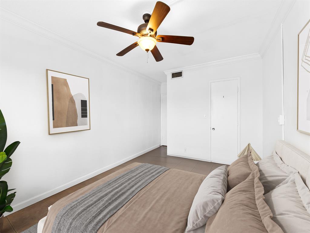 1475 Southeast 15th Street, Unit 311 Fort Lauderdale, FL 33316 - Photo 7 of 19 a view of a bedroom with a bed and wooden floor