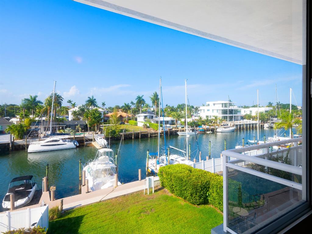 1475 Southeast 15th Street, Unit 311 Fort Lauderdale, FL 33316 - Photo 9 of 19 a view of a lake with boats and trees in the background