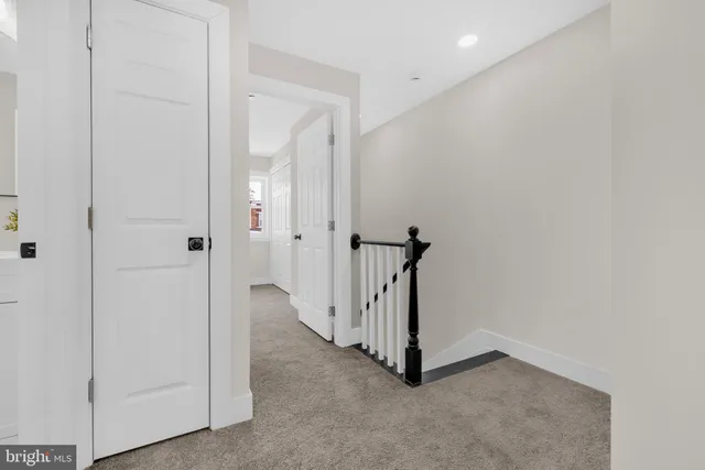 a view of a hallway with a white walls
