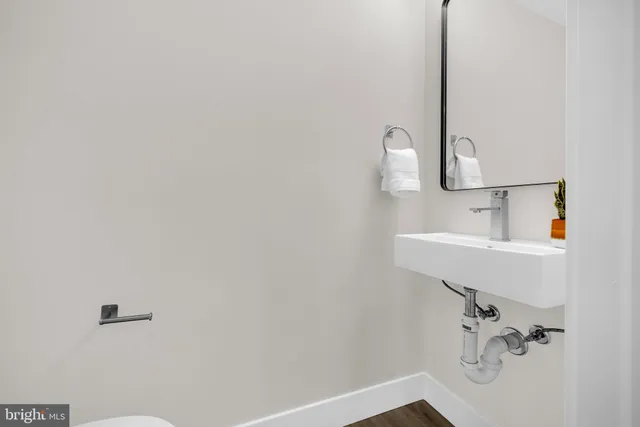 a bathroom with a sink and mirror