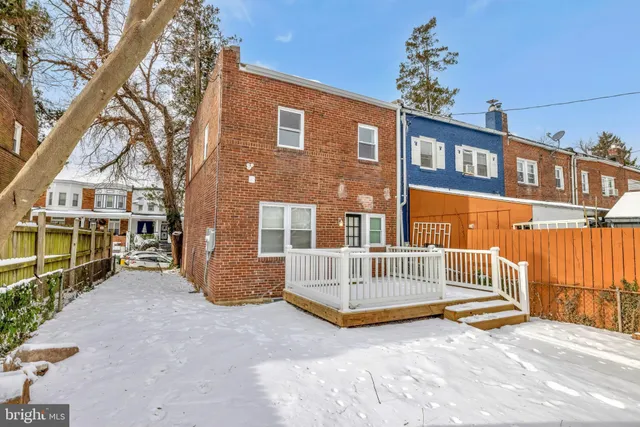 a view of a brick house with a large windows