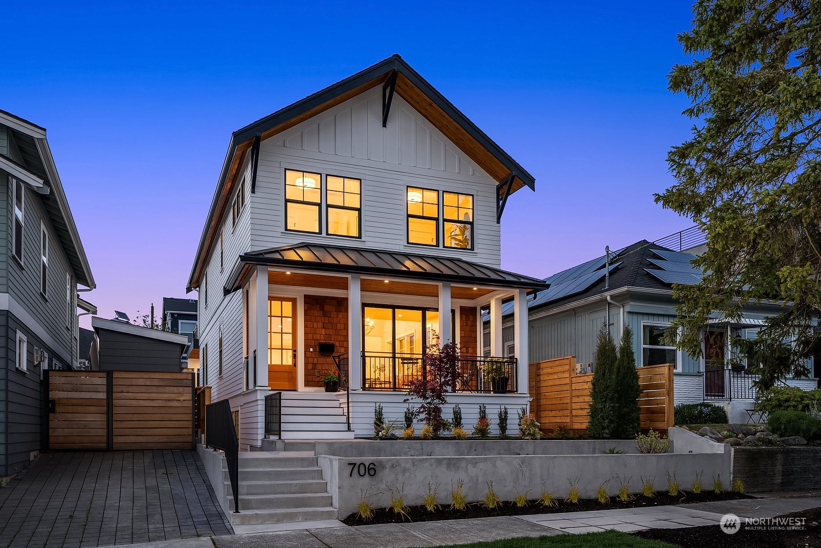 706 North 76th Street Seattle, WA 98103 - Photo 1 of 38 a front view of a house with a yard