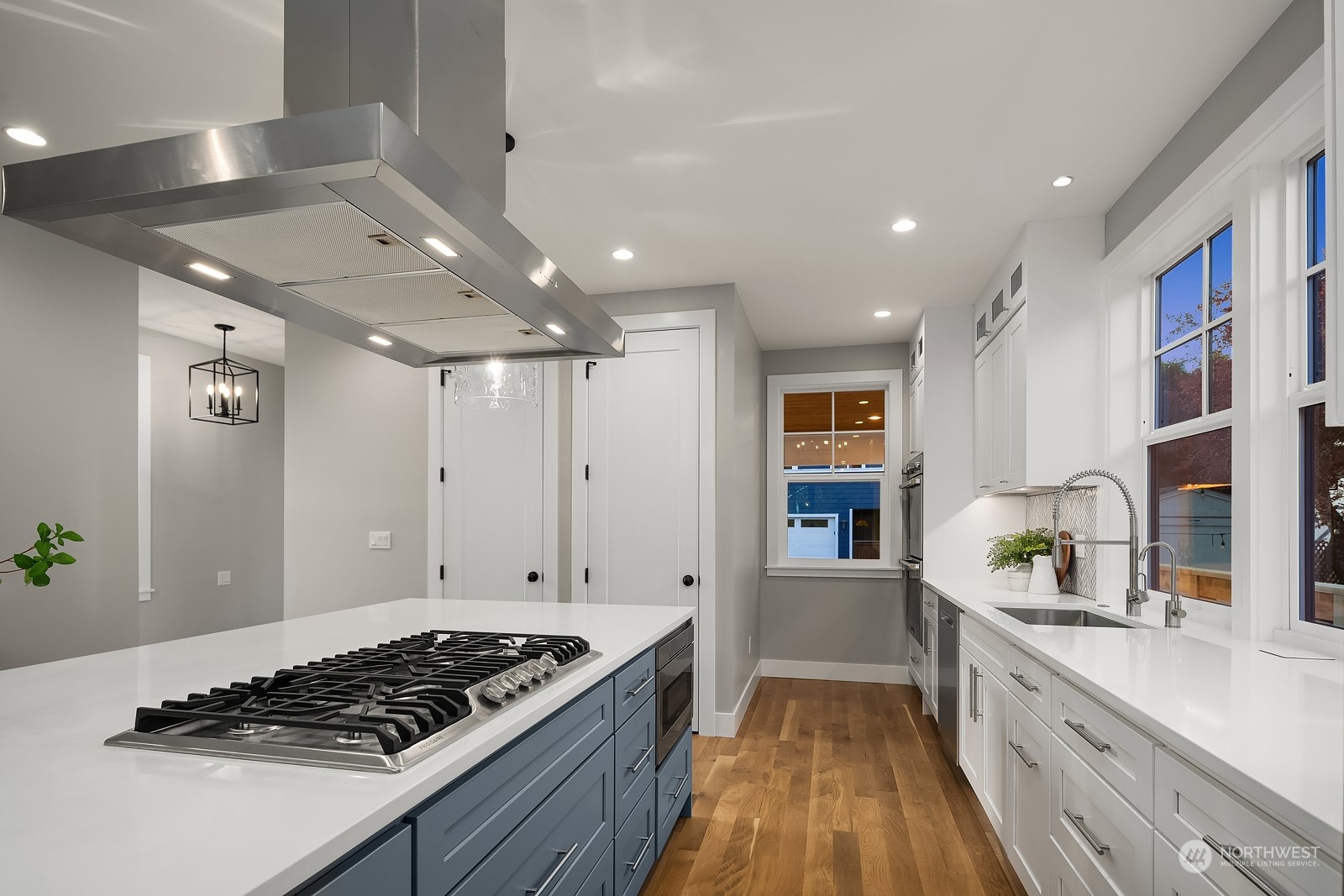 706 North 76th Street Seattle, WA 98103 - Photo 14 of 38 a kitchen with stainless steel appliances granite countertop a stove and a sink