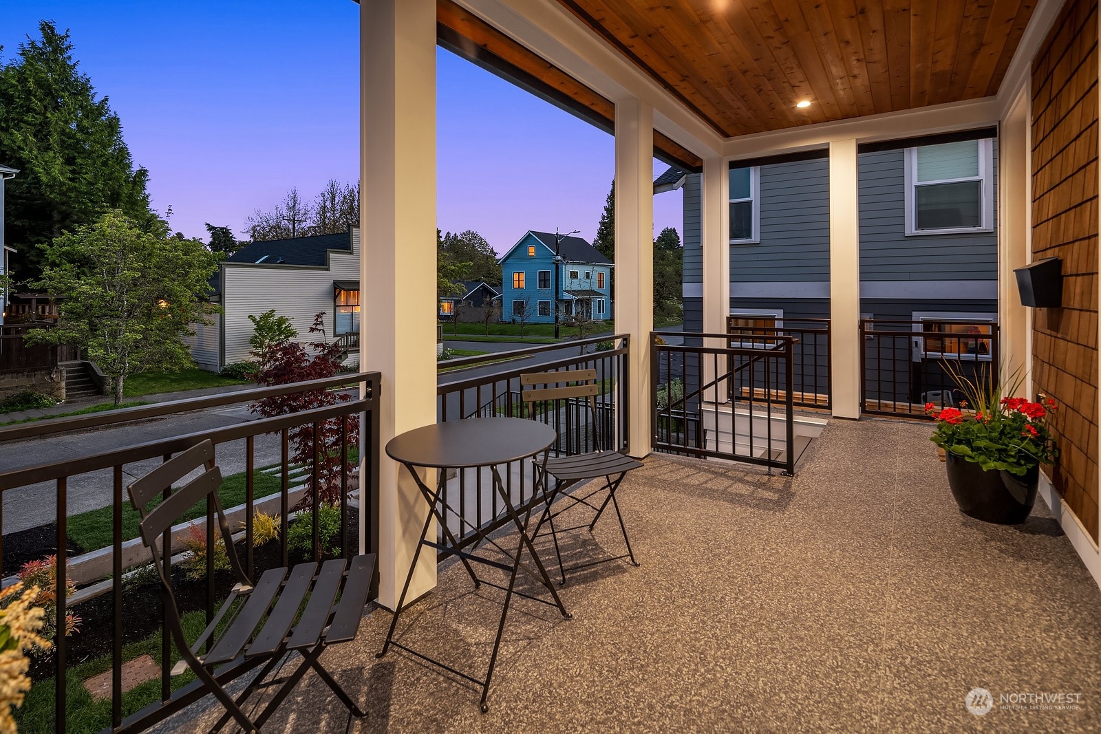 706 North 76th Street Seattle, WA 98103 - Photo 2 of 38 a view of a chairs and a table in the balcony