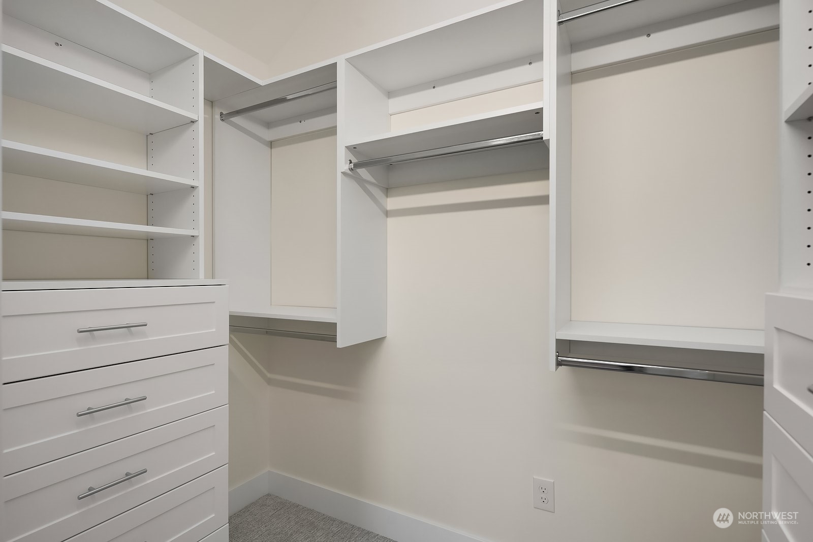 706 North 76th Street Seattle, WA 98103 - Photo 23 of 38 a view of walk in closet with empty racks