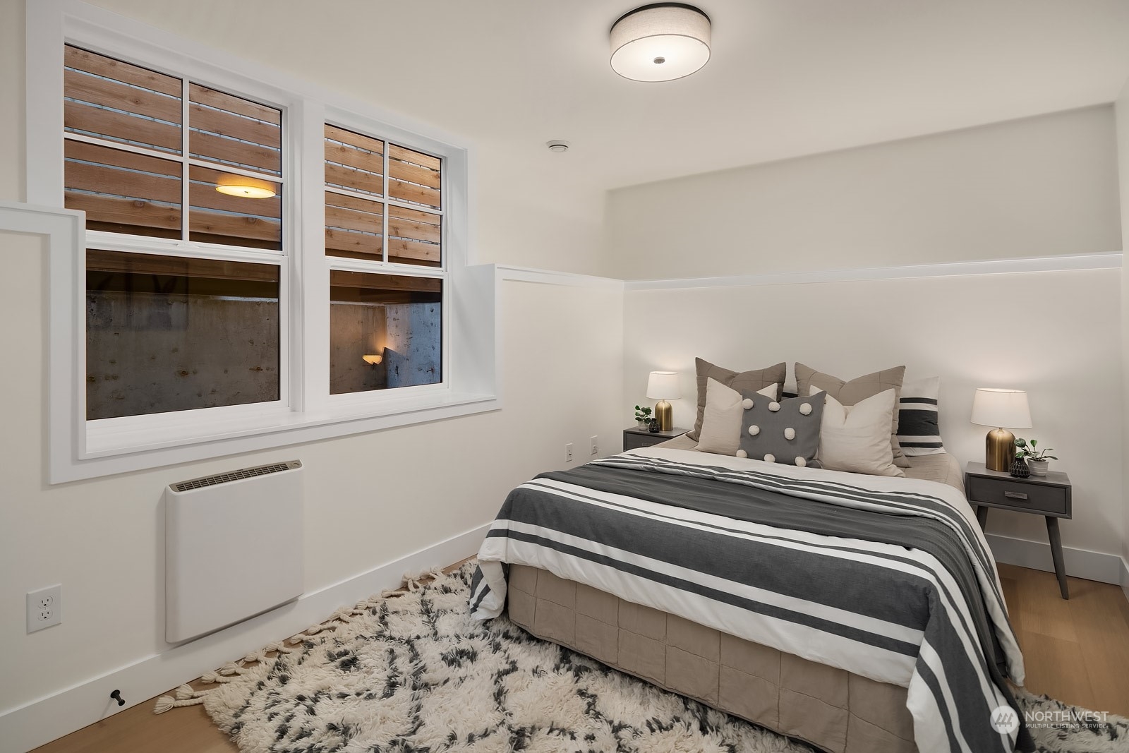 706 North 76th Street Seattle, WA 98103 - Photo 34 of 38 a bedroom with a bed and a window