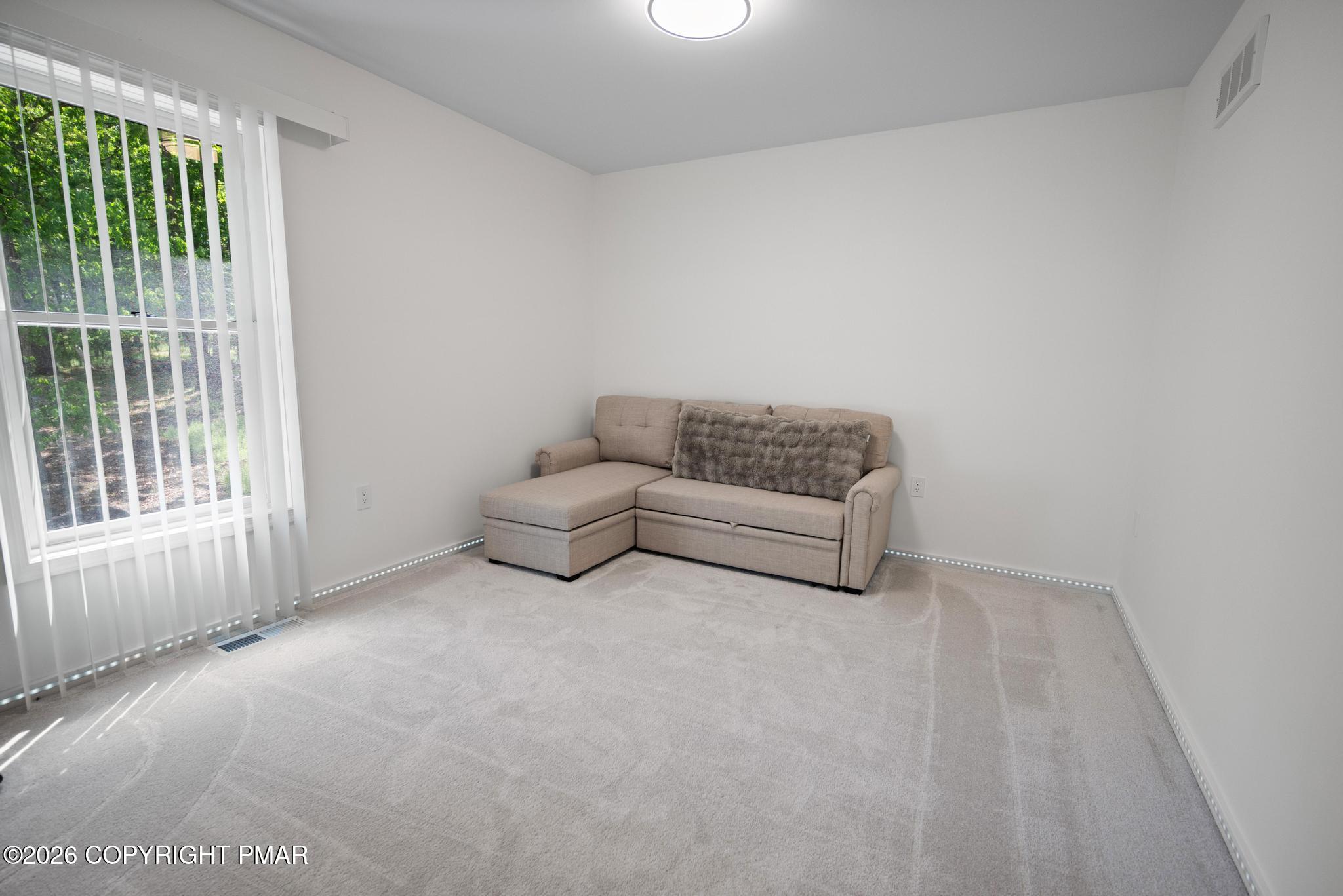 2312 Cramer Court Bushkill, PA 18324 - Photo 29 of 37 a living room with furniture and a window