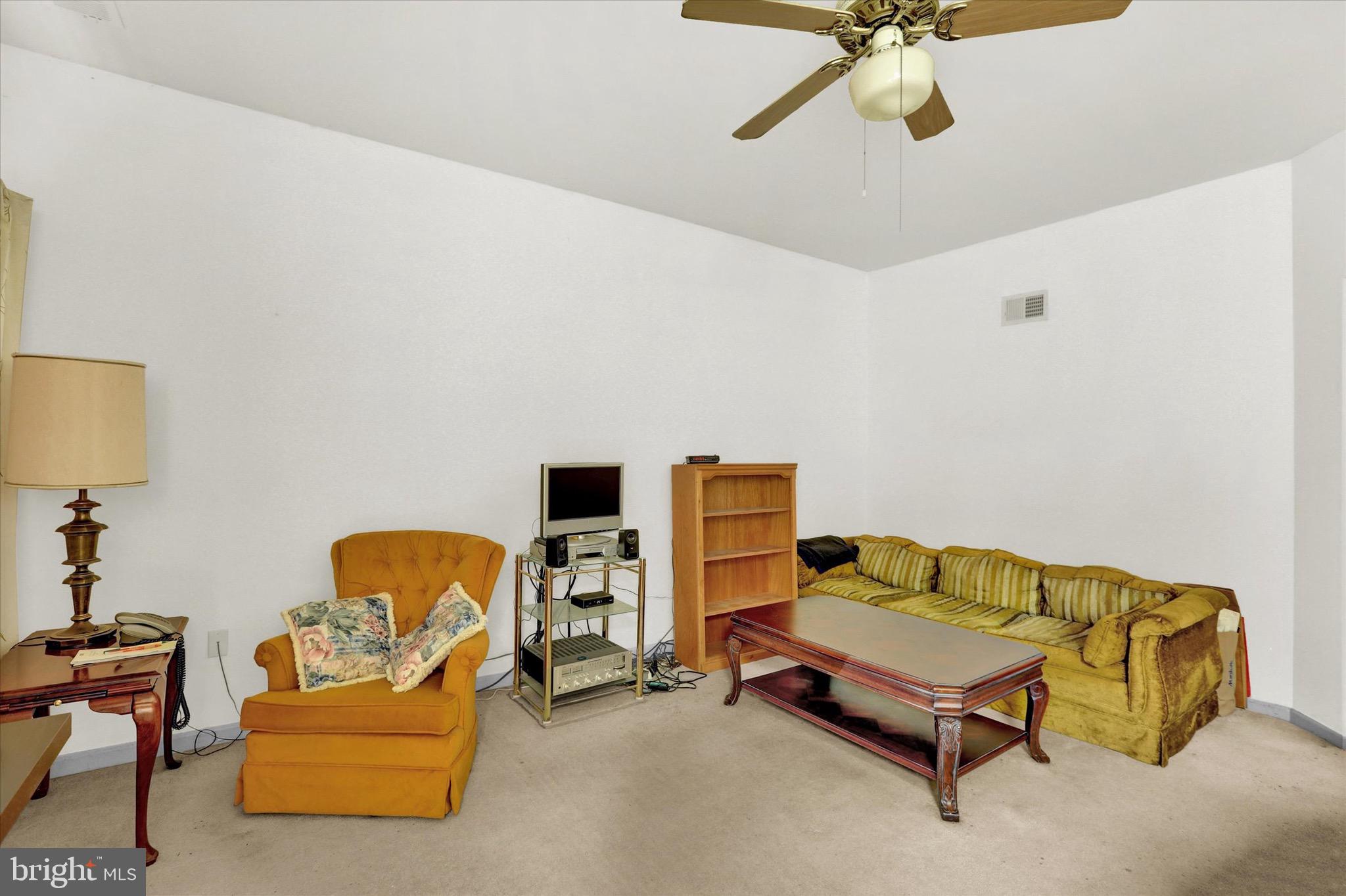 5 Brownstone Road Hightstown, NJ 08520 - Photo 11 of 21 a bedroom with a bed and lamp