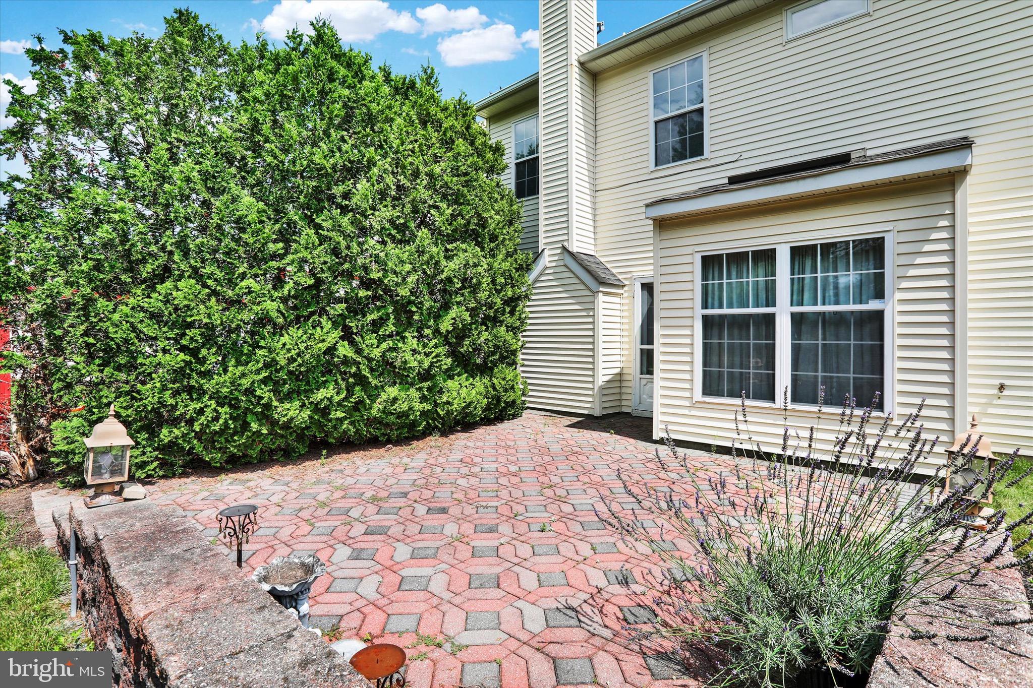 5 Brownstone Road Hightstown, NJ 08520 - Photo 21 of 21 a front view of a house with a garden
