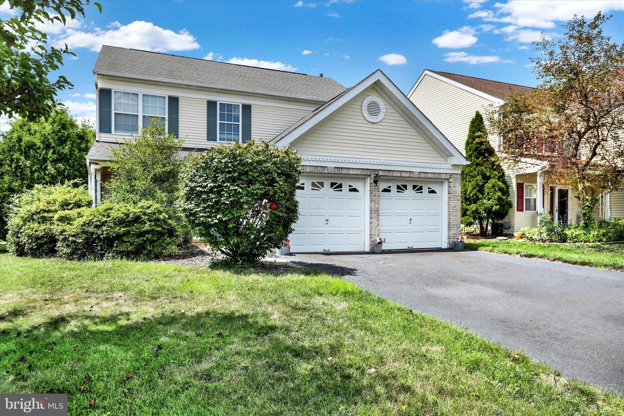 5 Brownstone Road Hightstown, NJ 08520 - Photo 3 of 21 a front view of a house with a yard and garage