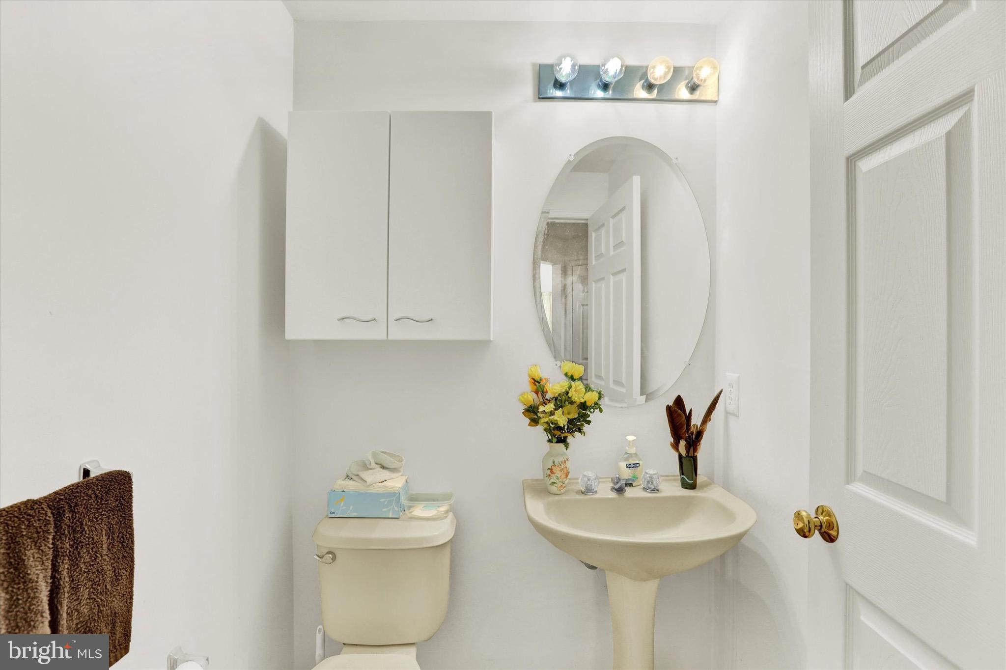 5 Brownstone Road Hightstown, NJ 08520 - Photo 7 of 21 a bathroom with a sink mirror and vanity