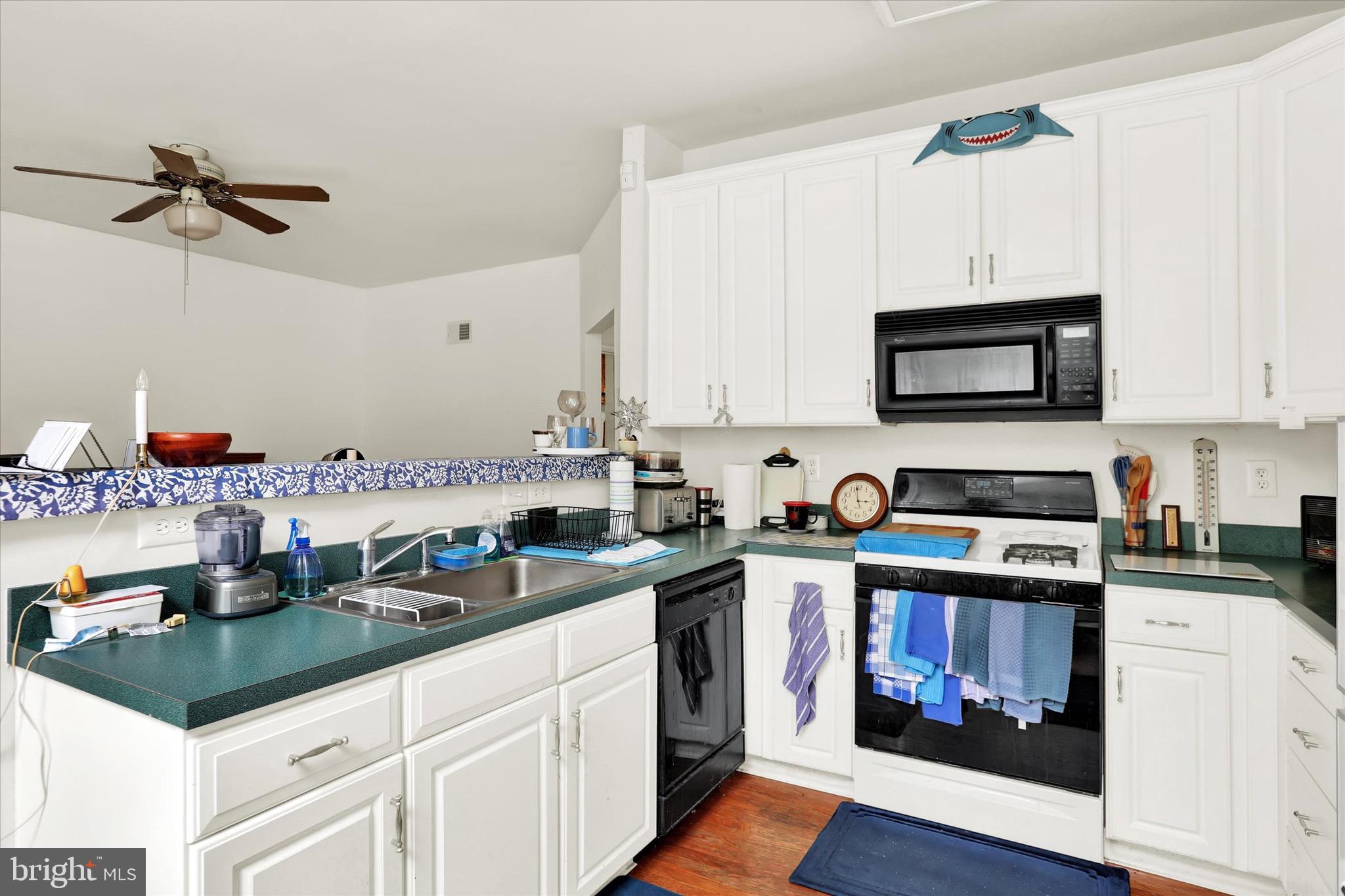 5 Brownstone Road Hightstown, NJ 08520 - Photo 8 of 21 a kitchen with stainless steel appliances granite countertop a sink and cabinets