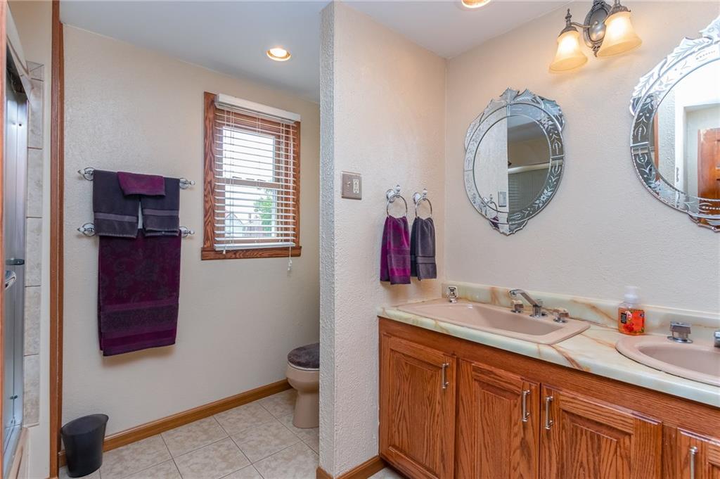 410 Ohio Avenue Rochester, PA 15074 - Photo 16 of 23 Updated Full bath with ceramic tile great storage cabinets and double bowl sinks.