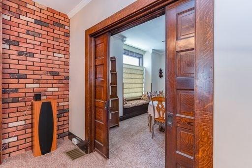 410 Ohio Avenue Rochester, PA 15074 - Photo 3 of 23 Pocket Doors and exposed brick adds so much charm.