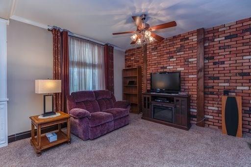 410 Ohio Avenue Rochester, PA 15074 - Photo 4 of 23 Living Room with large picture window and exposed brick.