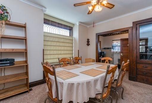 410 Ohio Avenue Rochester, PA 15074 - Photo 6 of 23 Dining Room with Built ins, crown molding, and window bench with storage.