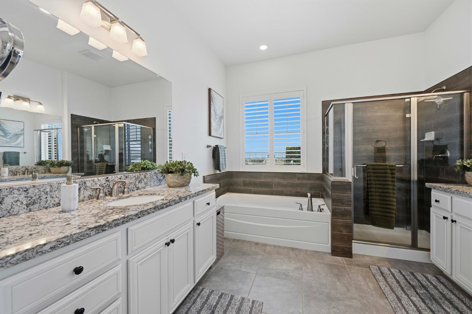 2259 Ranch View Drive Rocklin, CA 95765 - Photo 19 of 54 full bath featuring two vanities, a garden tub, a stall shower, and recessed lighting