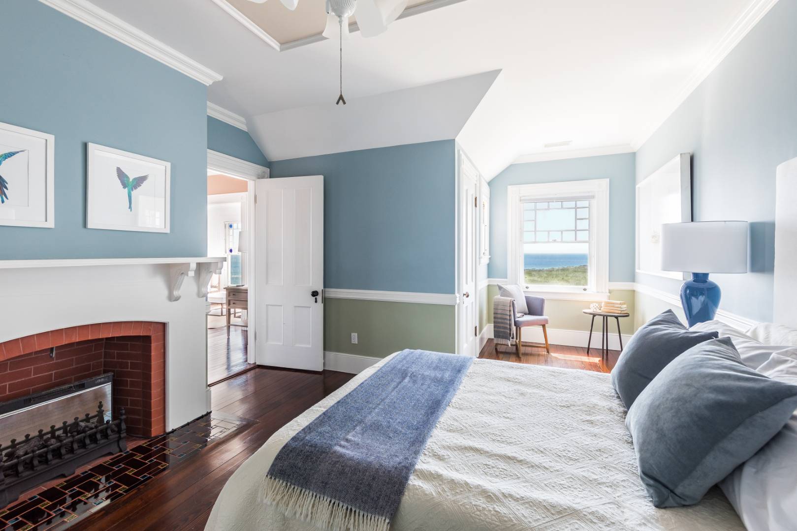 176 Deforest Road Montauk, NY 11954 - Photo 12 of 37 a bedroom with a bed and a fireplace