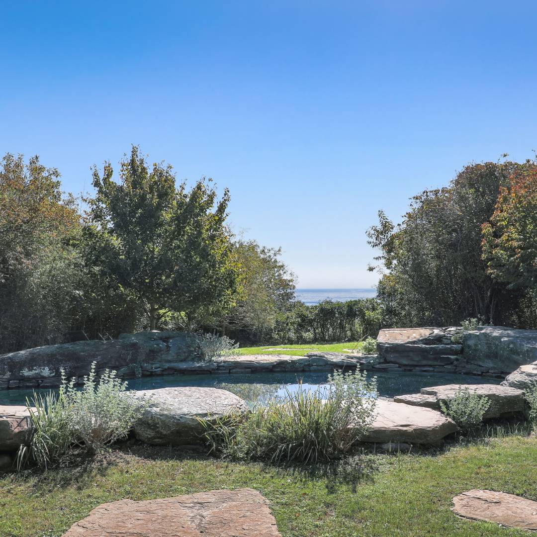 176 Deforest Road Montauk, NY 11954 - Photo 27 of 37 a view of a lake with houses in the back