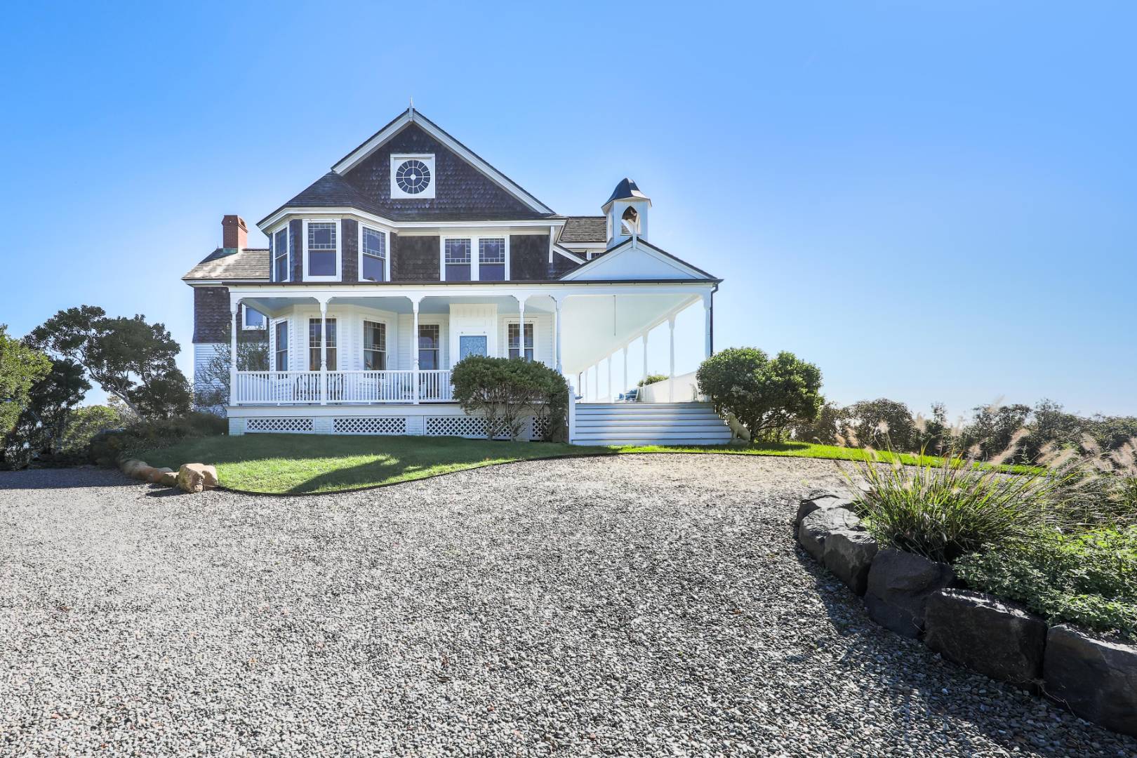 176 Deforest Road Montauk, NY 11954 - Photo 31 of 37 a front view of a house with a yard and potted plants