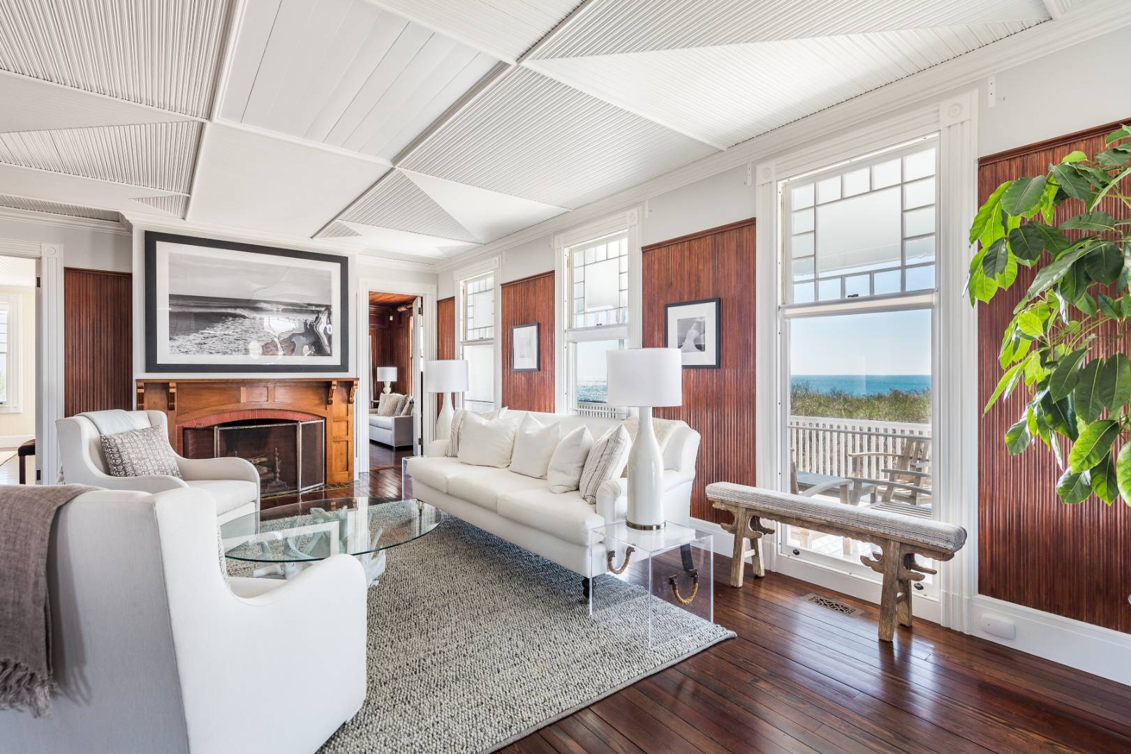 176 Deforest Road Montauk, NY 11954 - Photo 5 of 37 a living room with furniture and a large window with wooden floor