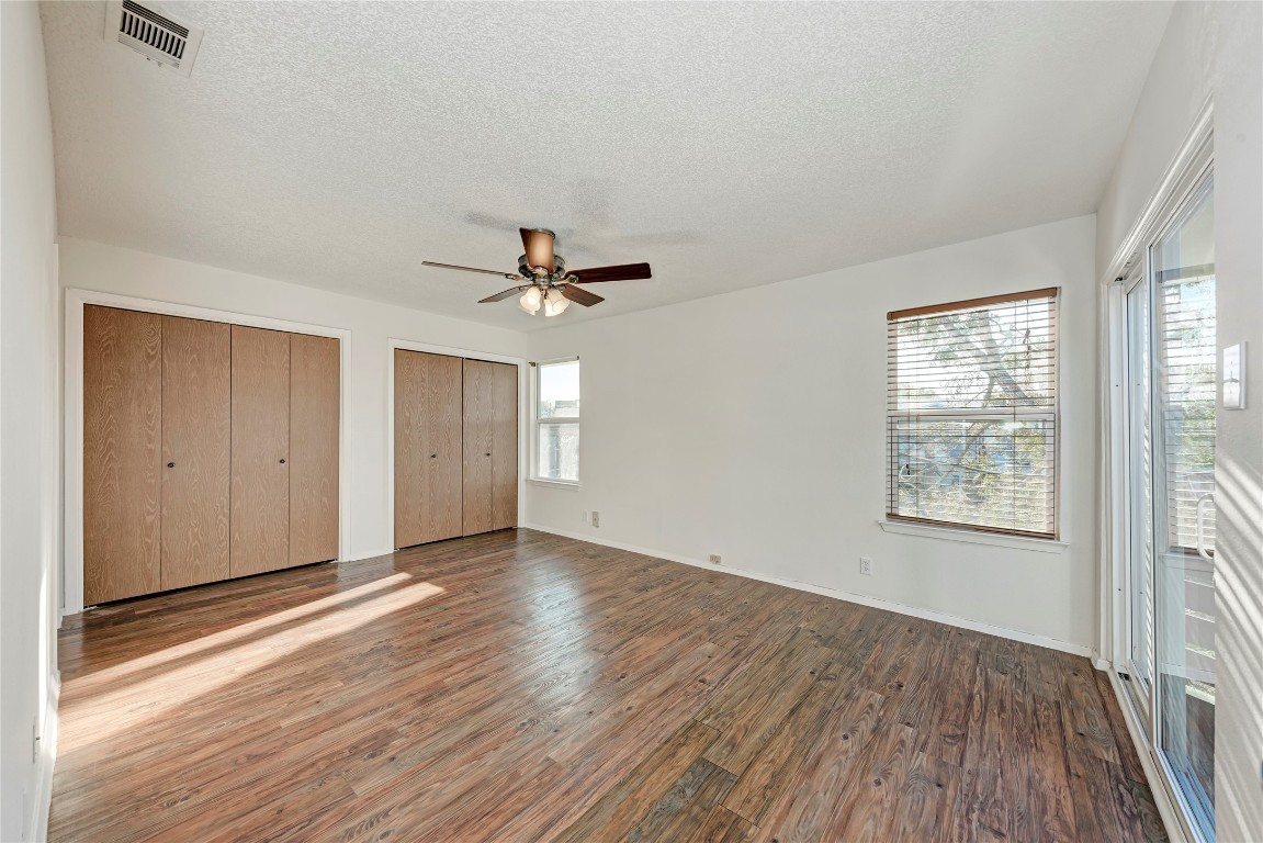 2106 Nickerson Street, Unit 203 Austin, TX 78704 - Photo 16 of 38 an empty room with wooden floor closet and windows