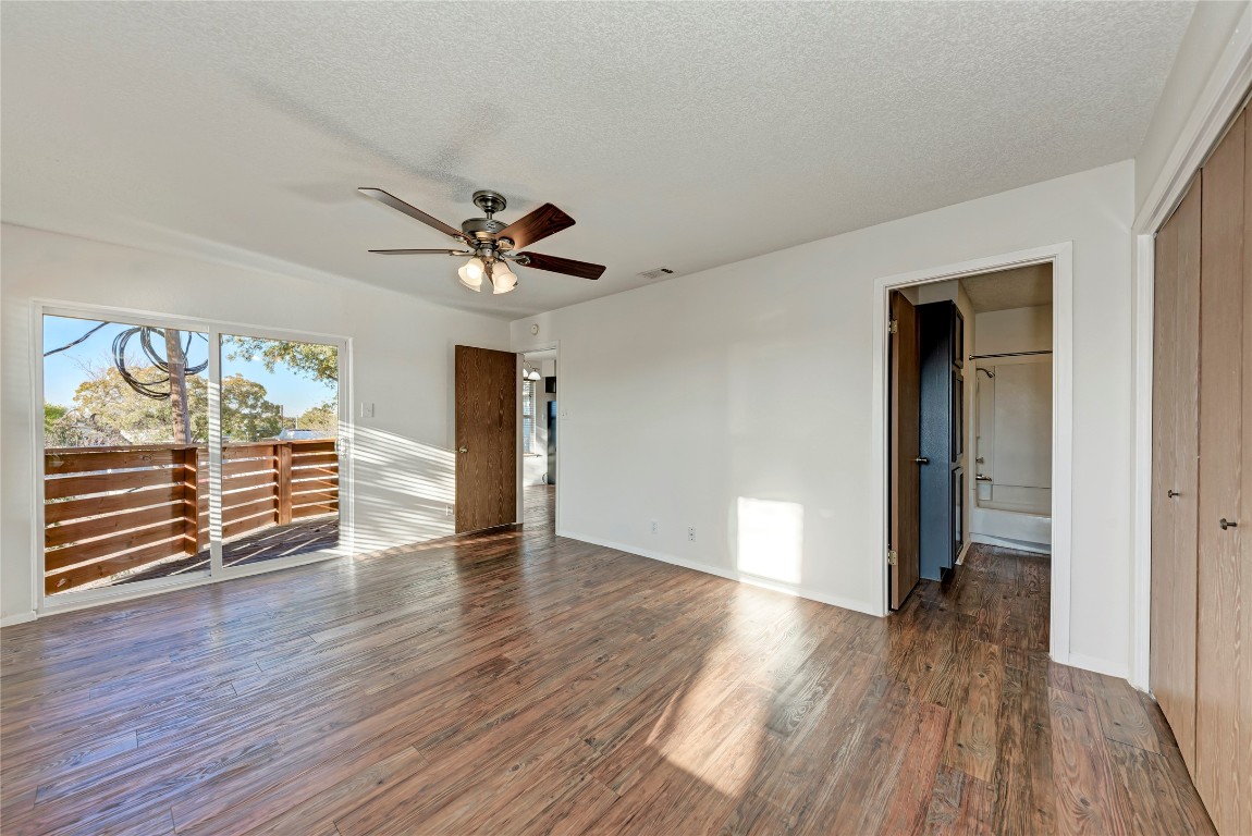 2106 Nickerson Street, Unit 203 Austin, TX 78704 - Photo 17 of 38 wooden floor in an empty room with a window
