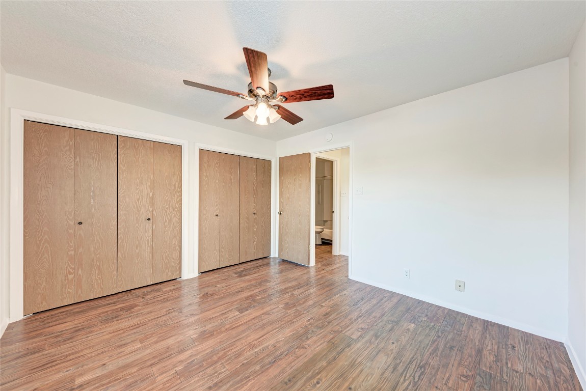 2106 Nickerson Street, Unit 203 Austin, TX 78704 - Photo 22 of 38 a view of a big room with wooden floor and a ceiling fan