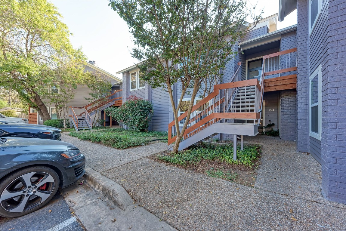 2106 Nickerson Street, Unit 203 Austin, TX 78704 - Photo 27 of 38 a front view of a house with garden