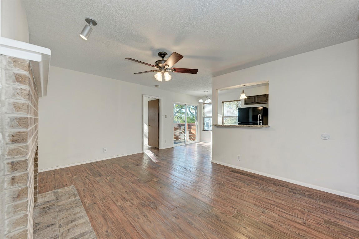 2106 Nickerson Street, Unit 203 Austin, TX 78704 - Photo 4 of 38 wooden floor in an empty room with a window