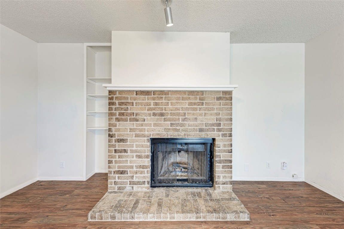 2106 Nickerson Street, Unit 203 Austin, TX 78704 - Photo 7 of 38 a living room with a fireplace
