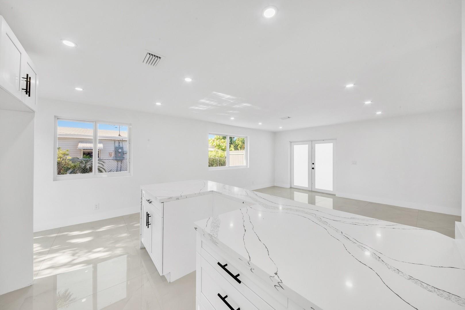 120 Northeast 57th Court Oakland Park, FL 33334 - Photo 7 of 20 a view of kitchen and windows