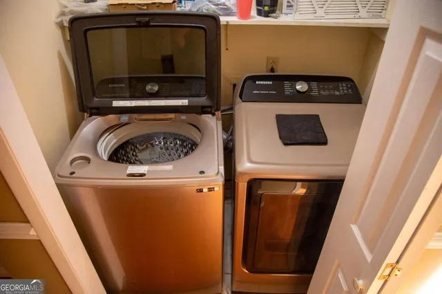 a utility room with dryer and washer