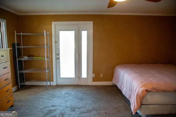 a bed room with a bed and a mirror