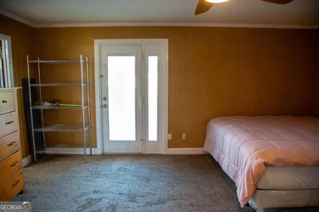 a bed room with a bed and a mirror