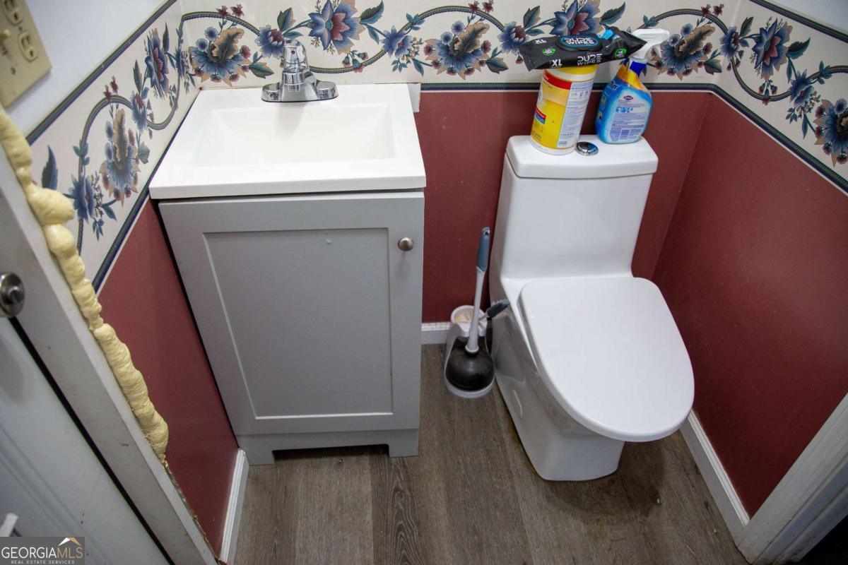 2115 Blackshear Highway Baxley, GA 31513 - Photo 29 of 41 a bathroom with a toilet and a sink