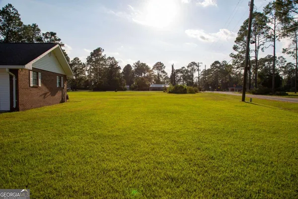 a view of an ocean house outdoor space and swimming pool