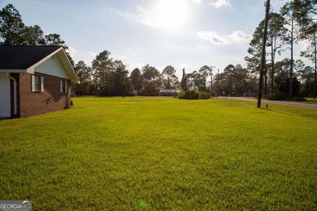 a view of an ocean house outdoor space and swimming pool