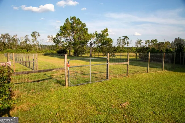 a view of a swimming pool with an outdoor space and seating area
