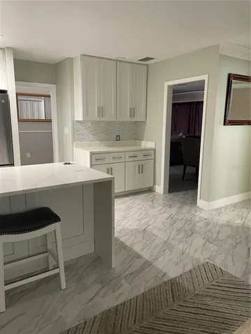 a kitchen with a sink cabinets and window