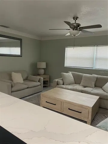 a living room with furniture and a window