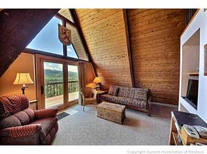93 U Road Silverthorne, CO 80498 - Photo 4 of 18 a outdoor living space with furniture and a fireplace