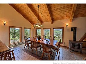 93 U Road Silverthorne, CO 80498 - Photo 5 of 18 a view of a dining room with furniture window and wooden floor