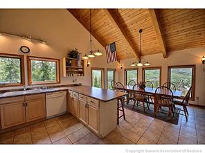93 U Road Silverthorne, CO 80498 - Photo 7 of 18 a open kitchen with stainless steel appliances granite countertop a stove and cabinets