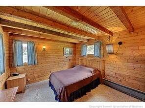 93 U Road Silverthorne, CO 80498 - Photo 10 of 18 a bedroom with a bed and a dresser