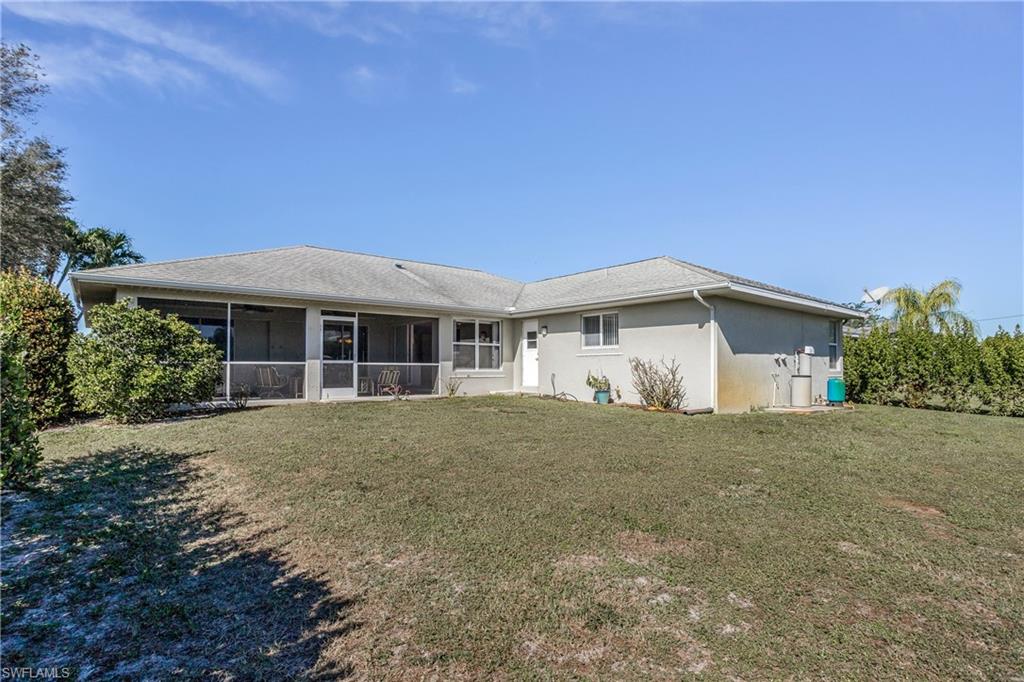 17509 Allentown Road Fort Myers, FL 33967 - Photo 19 of 20 a front view of a house with a yard and garage