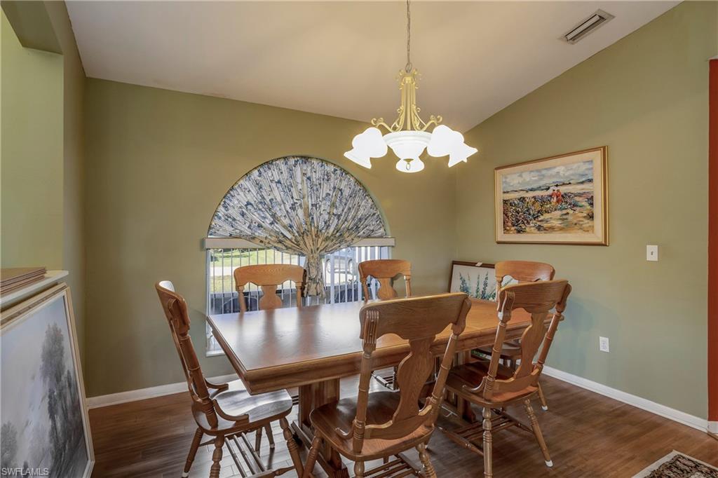 17509 Allentown Road Fort Myers, FL 33967 - Photo 5 of 20 a view of a dining room with furniture and chandelier