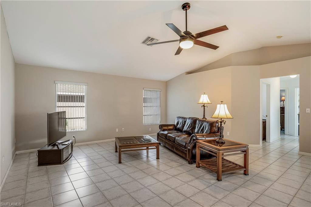17509 Allentown Road Fort Myers, FL 33967 - Photo 6 of 20 a living room with furniture a two chairs and a ceiling fan