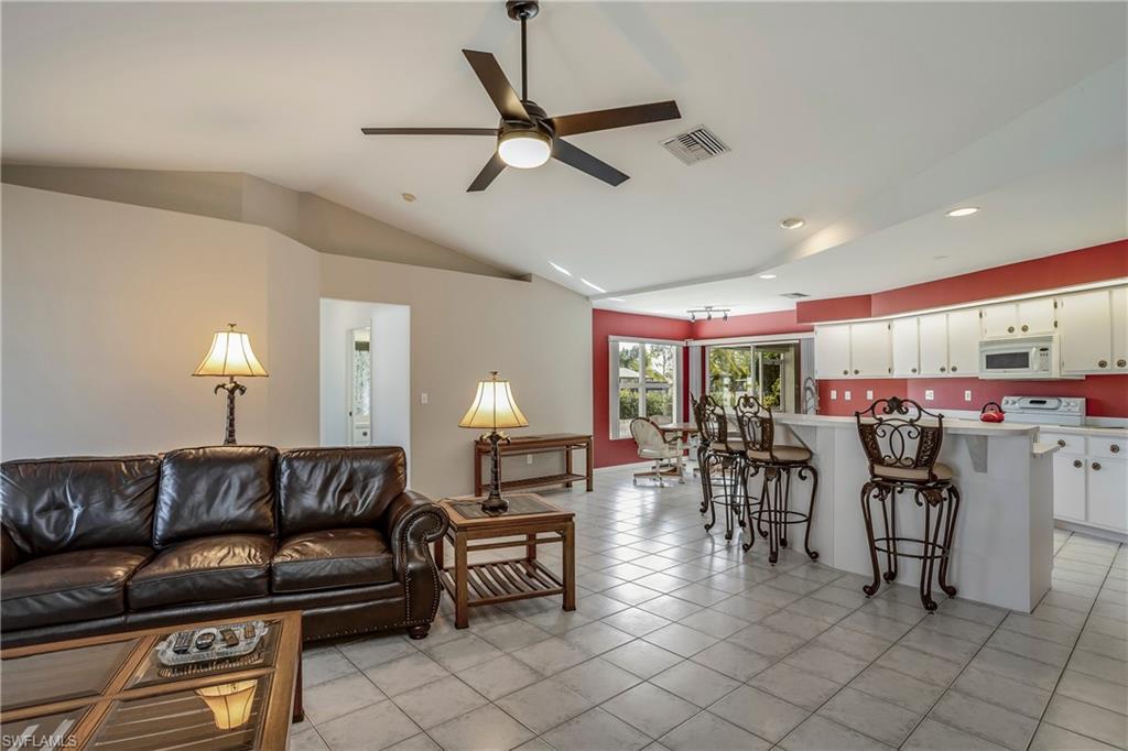 17509 Allentown Road Fort Myers, FL 33967 - Photo 7 of 20 a living room with furniture a ceiling fan and a large window