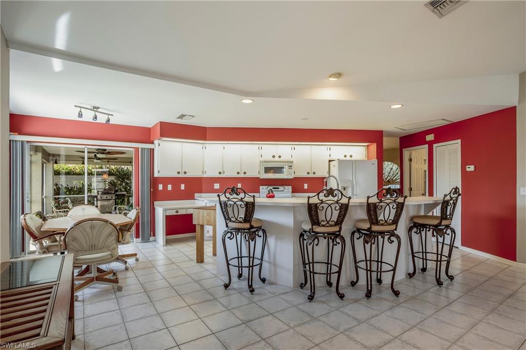 17509 Allentown Road Fort Myers, FL 33967 - Photo 9 of 20 a dinning table and chairs in a room